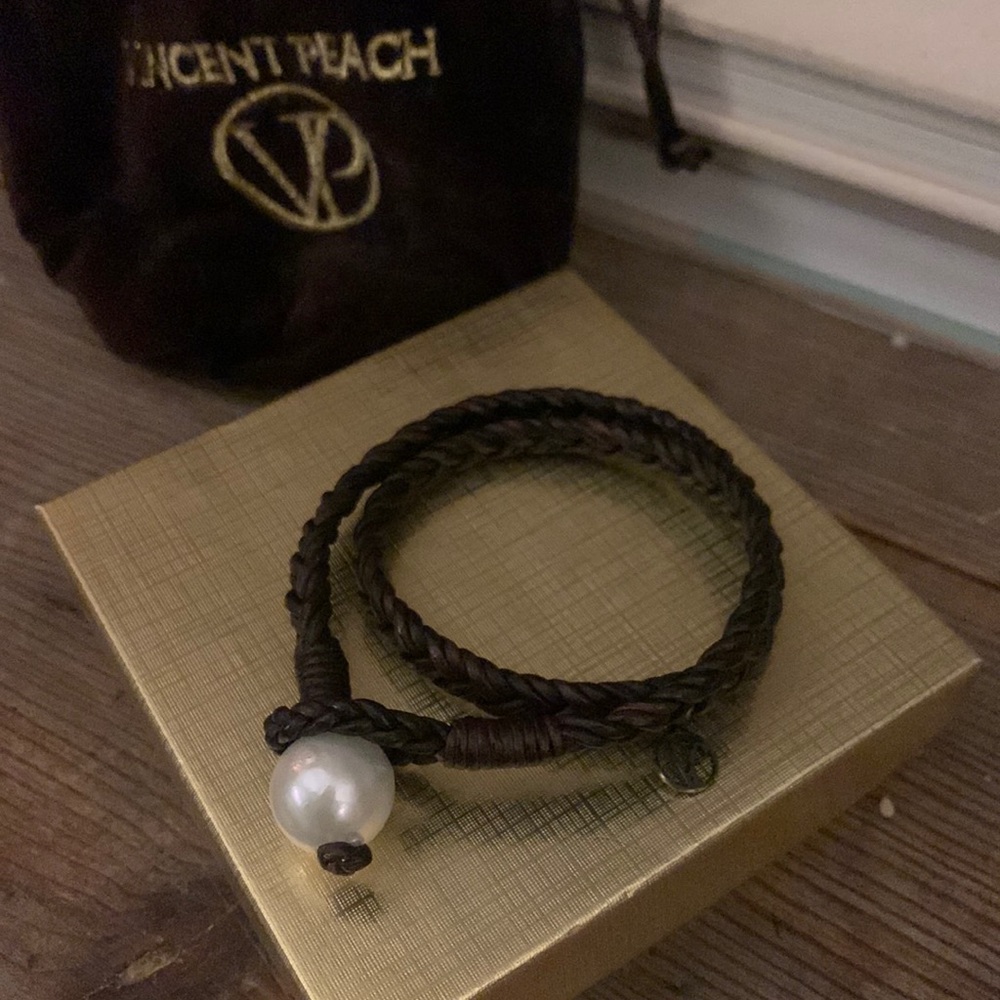 Vincent Peach bracelet. Never worn. Braided leather with pearl loop clasp.